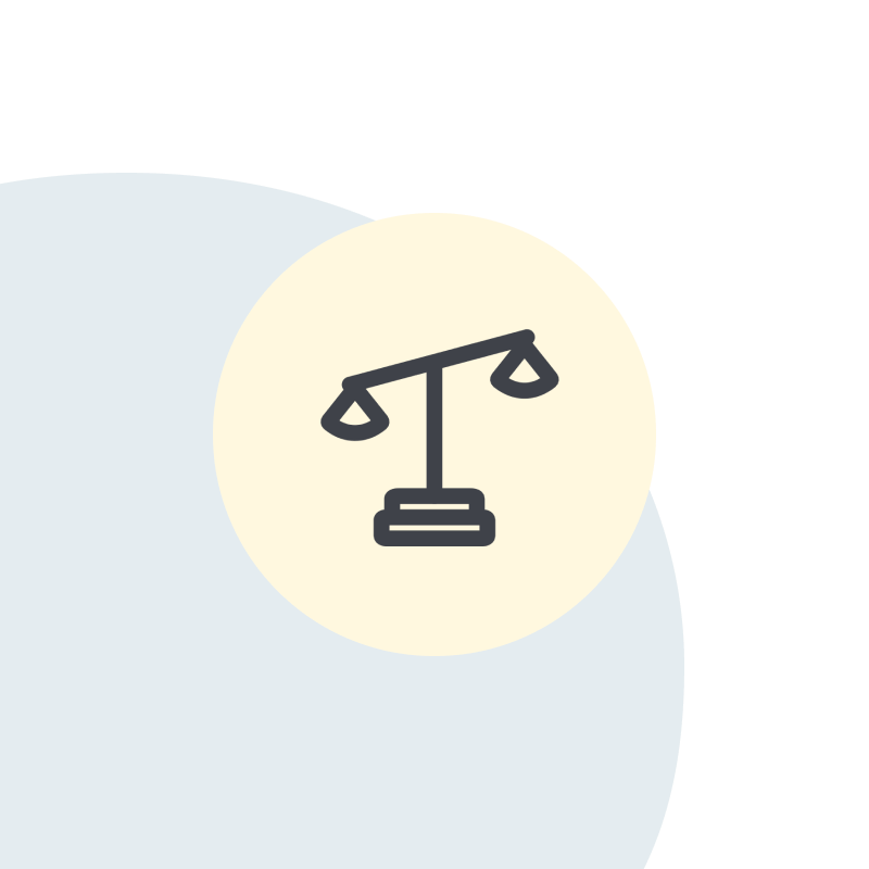 Eine Waage-Symbol auf beigem Kreis, überlappt von einem hellblauen Kreis.